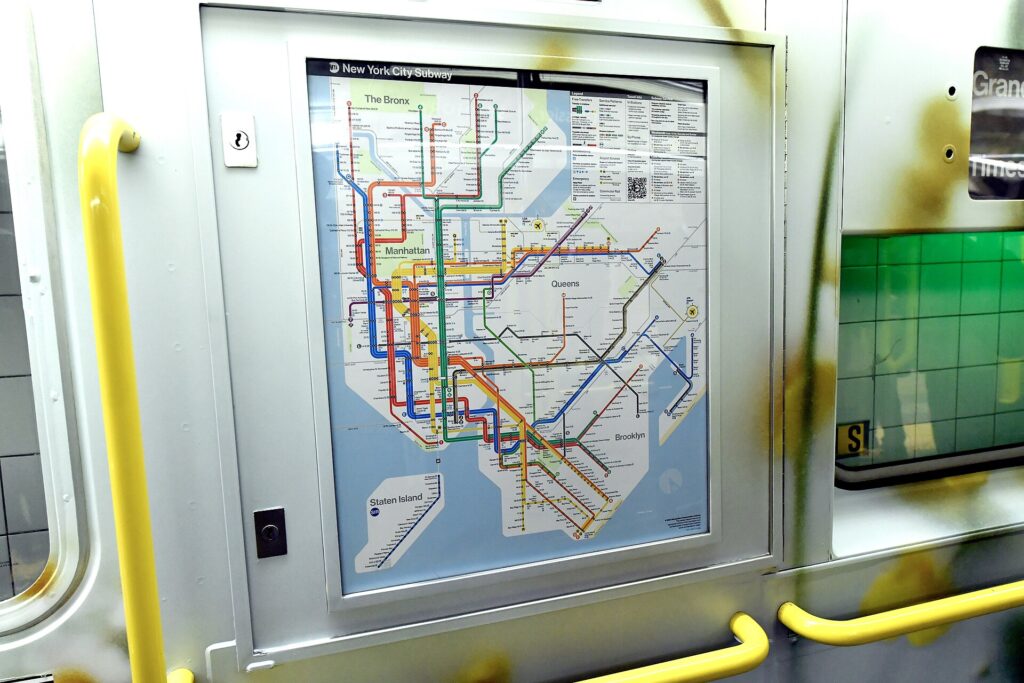 New York City subway map displayed inside a subway car for public navigation