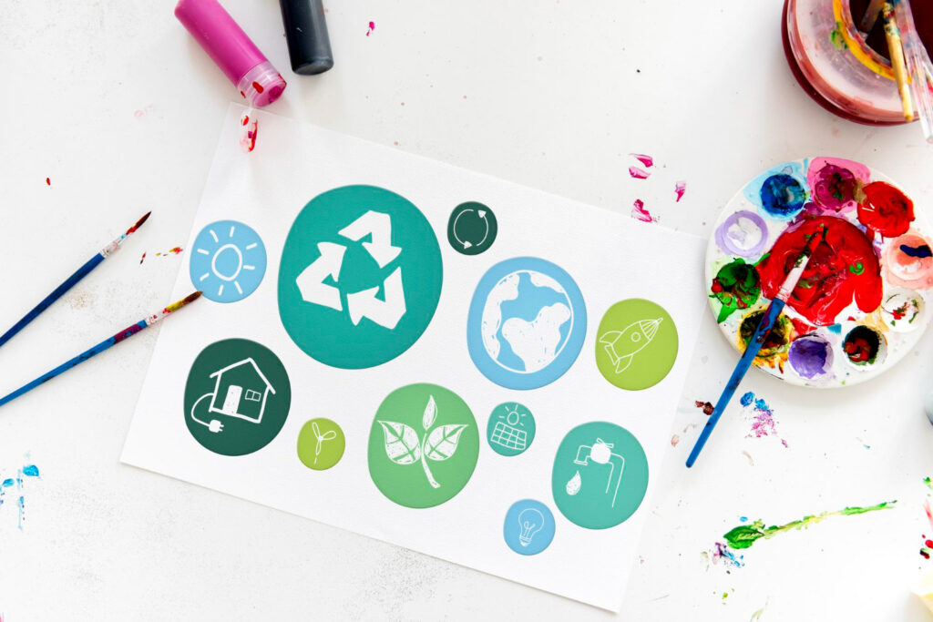 Graphic design icons representing sustainability including recycling symbol renewable energy and environmental design concepts