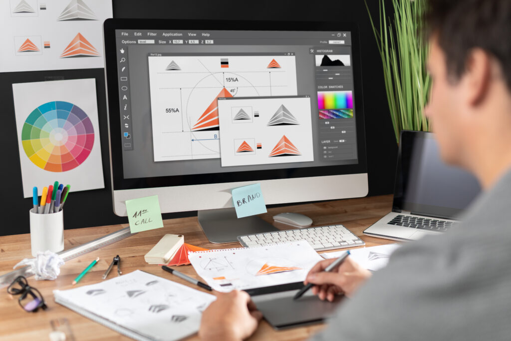 Graphic designer creating logo concepts and brand identity designs using professional design software